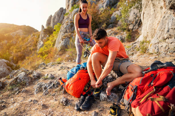 istock Young couple preparing for climbing 1301111976