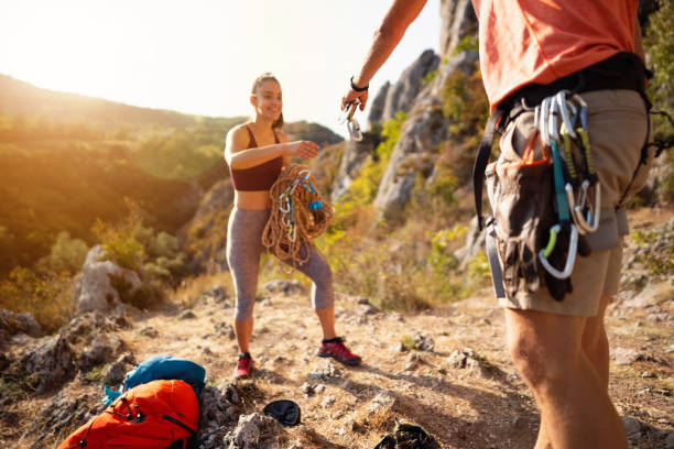 istock Young climbers preparing carbines on a safety rope for climbing 1301112029