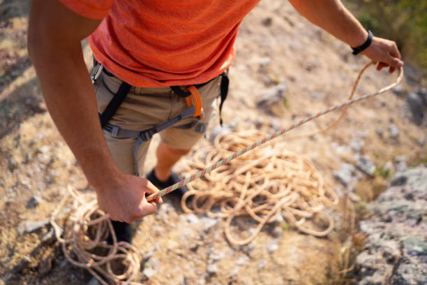 istock High angle view of an unrecognizable man preparing climbing rope 1301112050