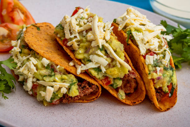 istock Mexican tacos accompanied by tomato and cilantro 1301113195