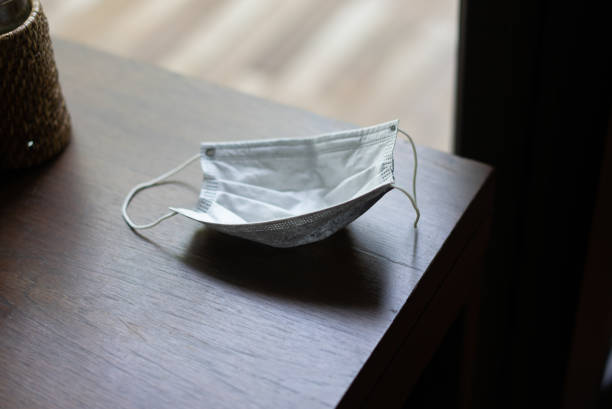 istock protect mask from covid 19 on table for new normal 1301114156
