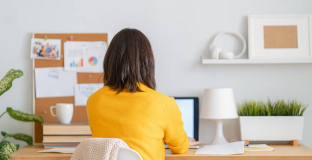 istock woman working on a laptop 1301114352