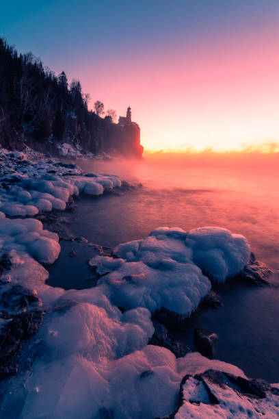sea smoke at split rock sunrise - winter lake snow fog imagens e fotografias de stock