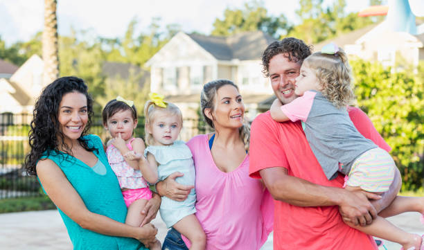 istock Family and friends with three young daughters 1301117854