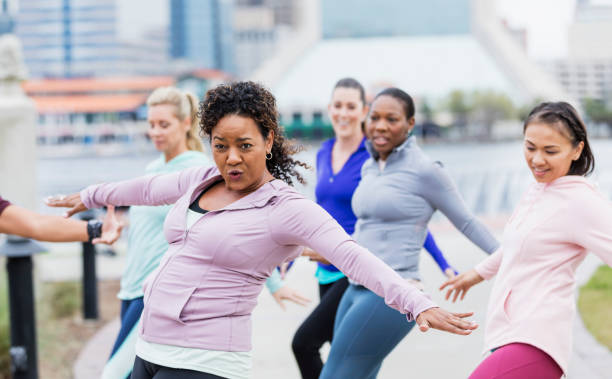 istock Multi-ethnic group of women taking dance exercise class 1301118394