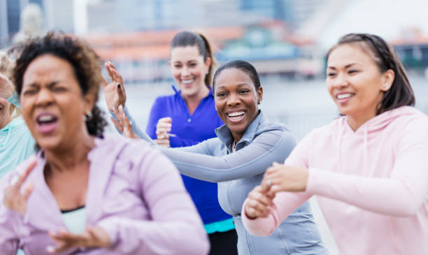 istock Multi-ethnic group of women taking dance exercise class 1301118402
