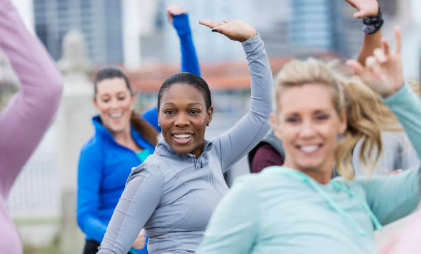 istock African-American woman in group exercise class 1301118408