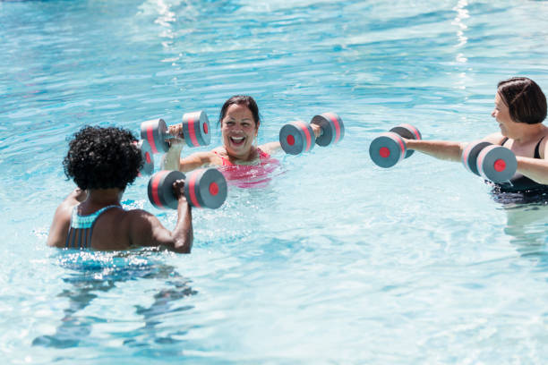 istock Three senior women doing water aerobics 1301118678