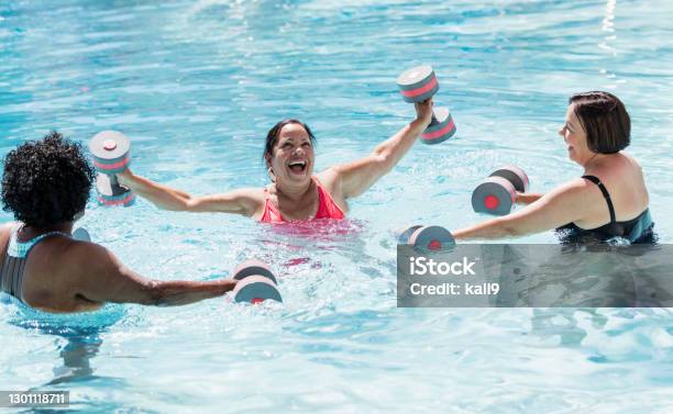 Three Senior Women Doing Water Aerobics Stock Photo - Download Image Now - Swimming Pool, People, Florida - US State