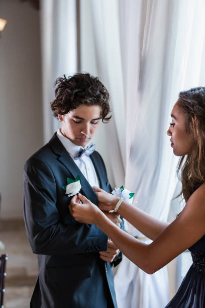 Teenage couple dressed for prom