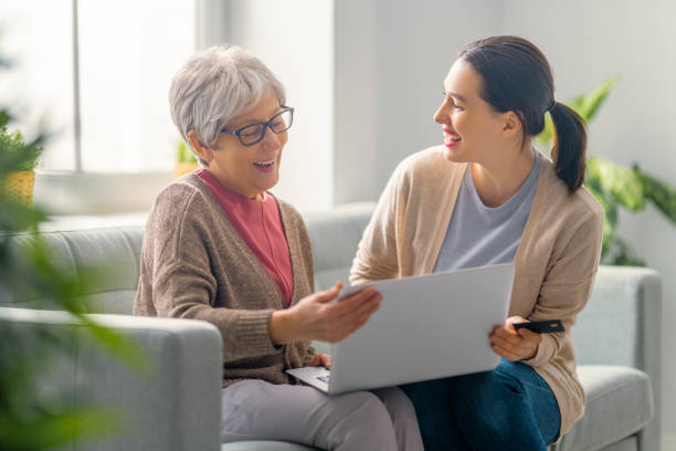 istock Young and senior women are using laptop 1301119785