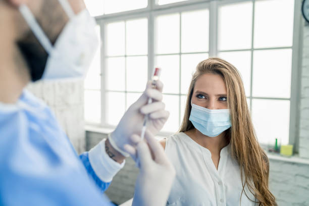 istock Woman having Vaccine Injection 1301124215