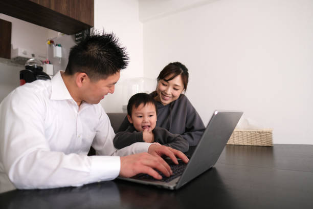 istock Father working from home with child and wife 1301124265