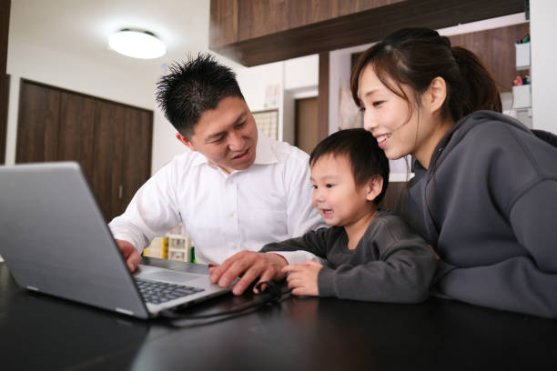 istock Father working from home with child and wife 1301124285
