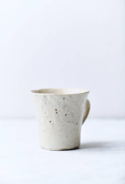 istock Traditional, handcrafted ceramic on bright wooden background. Soft focus. Copy space. 1301126396