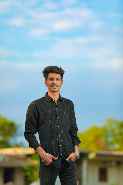 istock Young handsome indian man wearing black shirt 1301127213