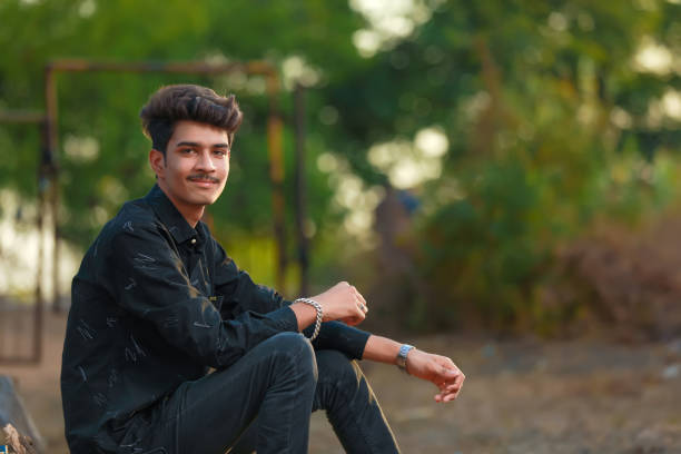 istock Young handsome indian man wearing black shirt 1301127270
