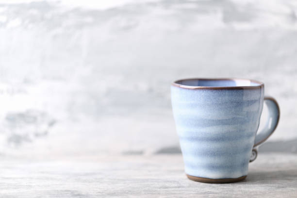 istock Traditional, handcrafted ceramic on bright wooden background. Soft focus. Copy space. 1301135101