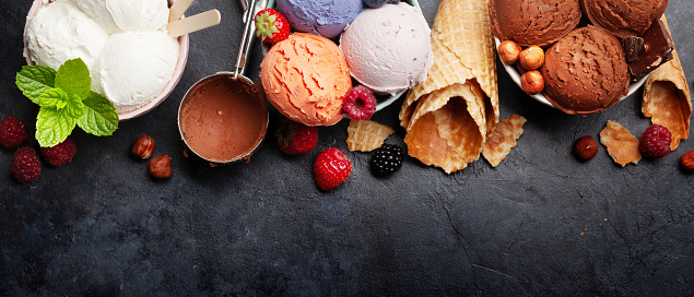 Berry, vanilla and chocolate ice cream scoops. Top view flat lay