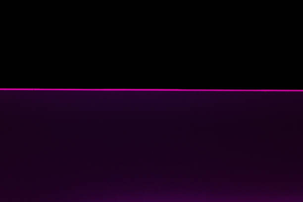 Pink neon still water against black background