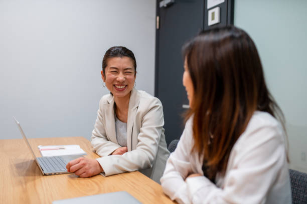 istock Two women in an office having a meeting 1301137267
