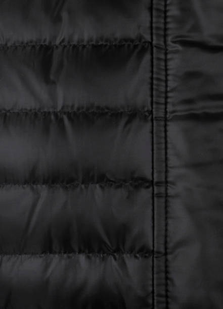 istock Close-up of a down jacket black color 1301138265