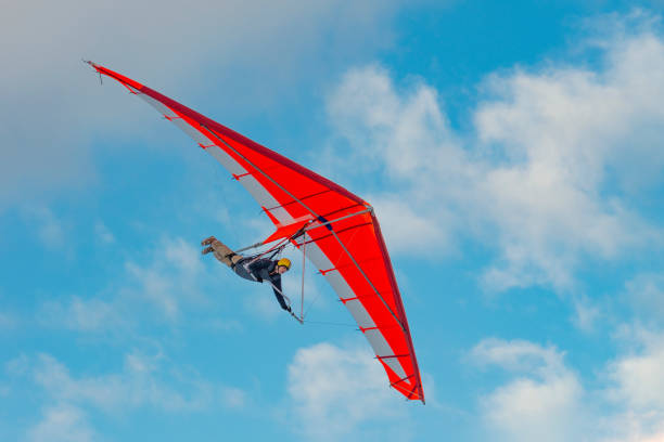 Bright paraglider wing in the sky. Extreme sports stock photo