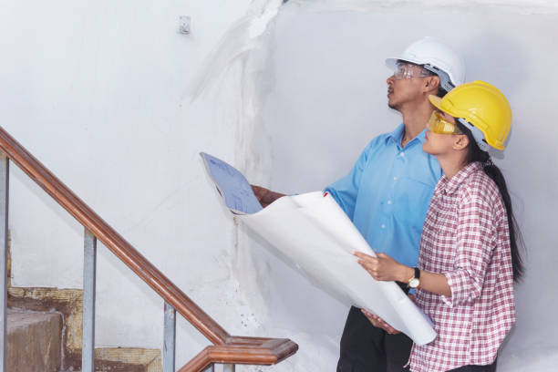 istock Construction engineer teamwork Safety Suit Trust Team Holding White Yellow Safety hard hat Security Equipment on Construction Site. Hardhat Protect Head for Civil Construction Engineer Concept 1301139343