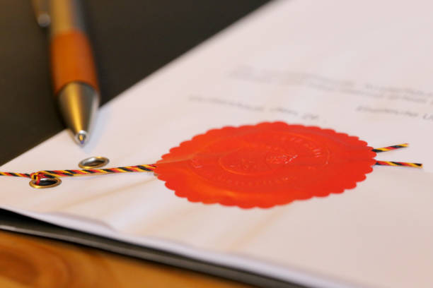 Notarized agreement with red official seal (Germany) Notarized agreement with red official seal (Germany) notary stock pictures, royalty-free photos & images