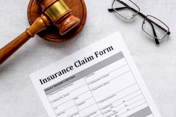 istock Insurance claim form with judge gavel . Top view 1301140056