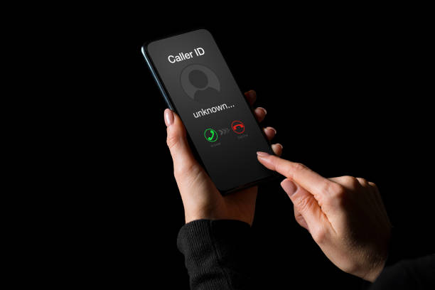 istock Person getting a call on phone from an unknown number 1301140178