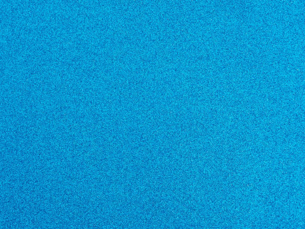 istock Light blue glitter color paper empty background texture for design. 1301140467