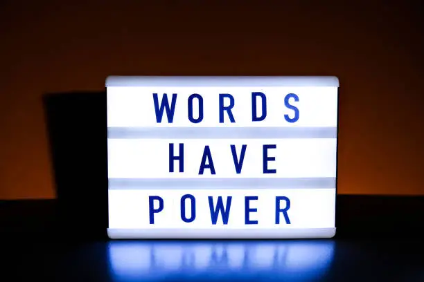 Photo of Lightbox with text WORDS HAVE POWER. Motivational Words Quotes Concept