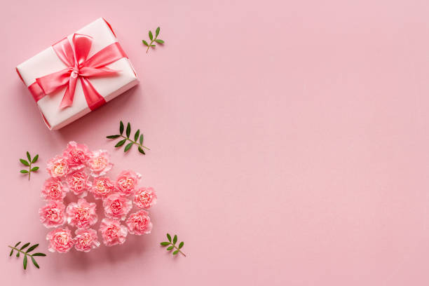 istock Valentines Day background with pink gift box and flowers 1301144369
