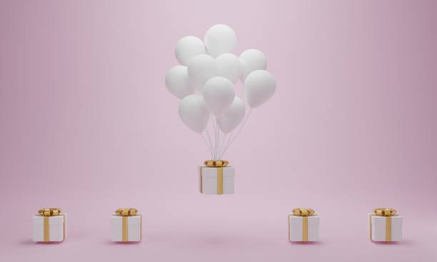 istock Gift box with white balloon floating on pink background. Minimal concept. 1301144575