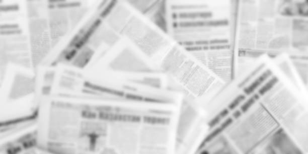 istock Abstract blurred image of old newspapers. Media news concept. Panoramic image. 1301144753
