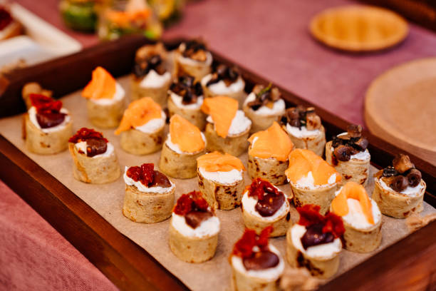 istock Catering. pancake rolls with curd cheese, fish, jerky tomatoes and mushrooms. 1301146177