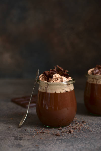 istock Delicious chocolate mousse or pudding with whipped cream 1301146504