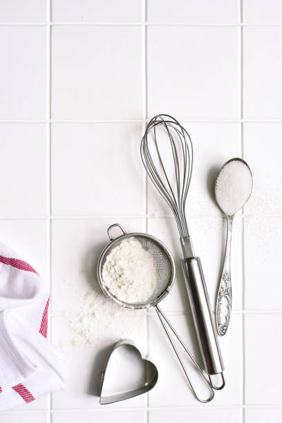 istock Culinary background with props and  ingredients for baking : flour, egg and sugar 1301147973
