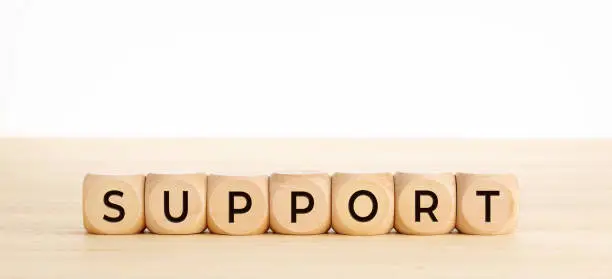 Photo of Support word on wooden blocks