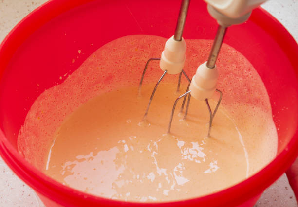 istock The dough is being prepared in a red bowl with a mixer 1301153700