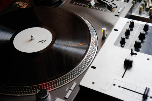 istock Dj turntable turntable playing vinyl disc with hip hop music 1301153775