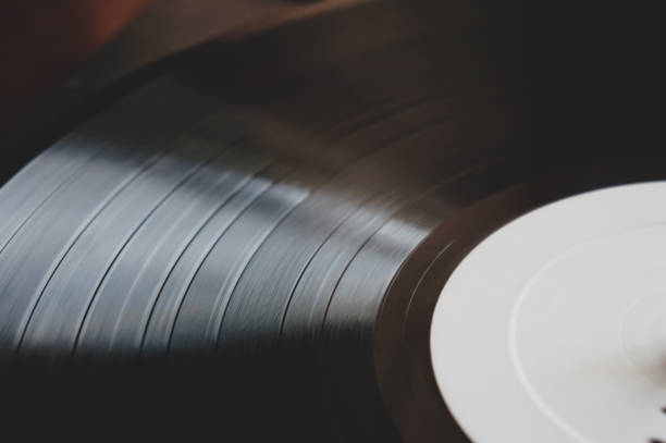 istock Dj turntable turntable playing vinyl disc with hip hop music 1301153827