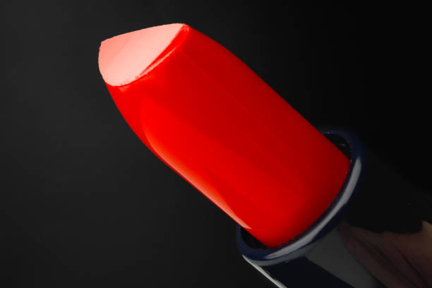 istock Red lipstick on black background close up 1301155543
