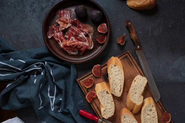 istock Spanish snacks with ham and figs. top view 1301155766
