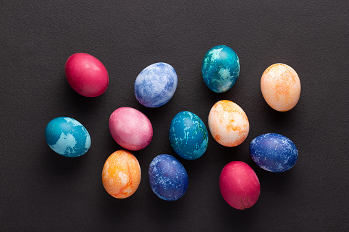 Easter eggs on dark stone background