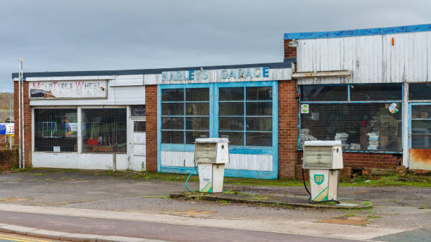 Mold, Flintshire; UK: Jan 28, 2021: Abandoned premises which were previously occupied by Harley's Garage are falling into disrepair