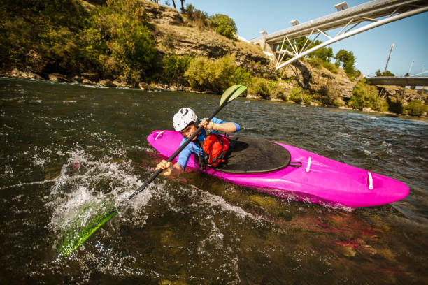 istock Guy in kayak sails mountain river. 1301158843