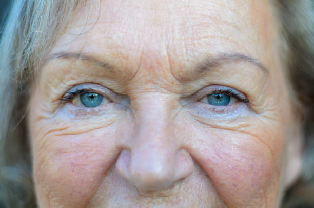 istock Attractive senior woman with blue eyes 1301159421