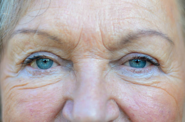 istock Attractive senior woman with blue eyes 1301159455